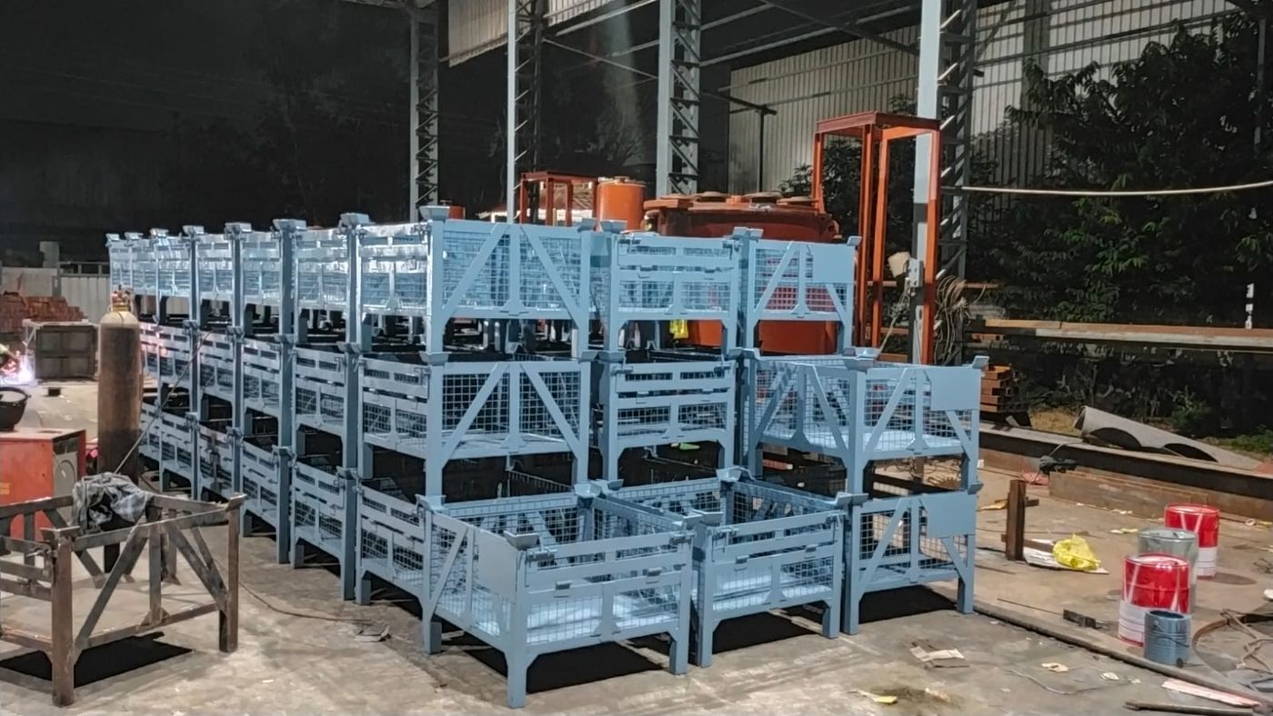 Rows of stackable painted wire mesh pallets